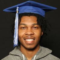 student wearing his graduate cap up close